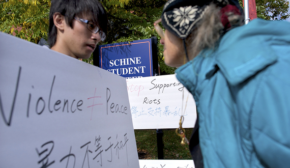 Students protest Dalai Lama’s visit outside of SU student center