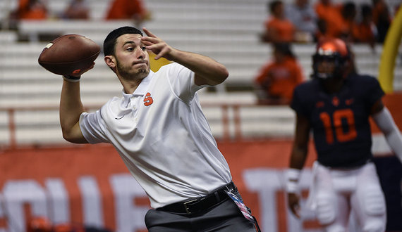 Football student managers balance academics, working for team