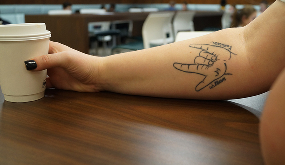 Senior connects with grandparents through sign language tattoo