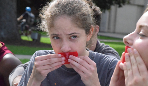Students hold red tape demonstration against sexual assault