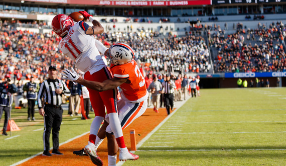 Liberty head coach Hugh Freeze coaching in a hospital bed versus Syracuse