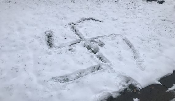Swastika drawn in snow across from 505 on Walnut