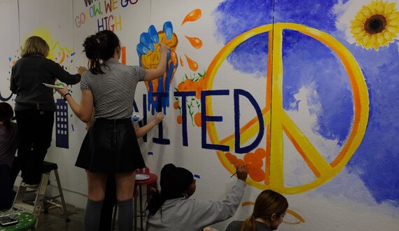 Students paint over racist graffiti found in art facility