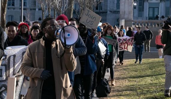 Faculty and students march across campus in support of #NotAgainSU