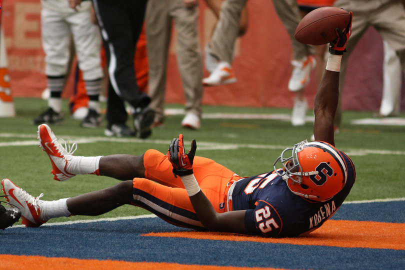 Wide receiver Jeremiah Kobena shows the ball after scoring a touchdown in the second half.