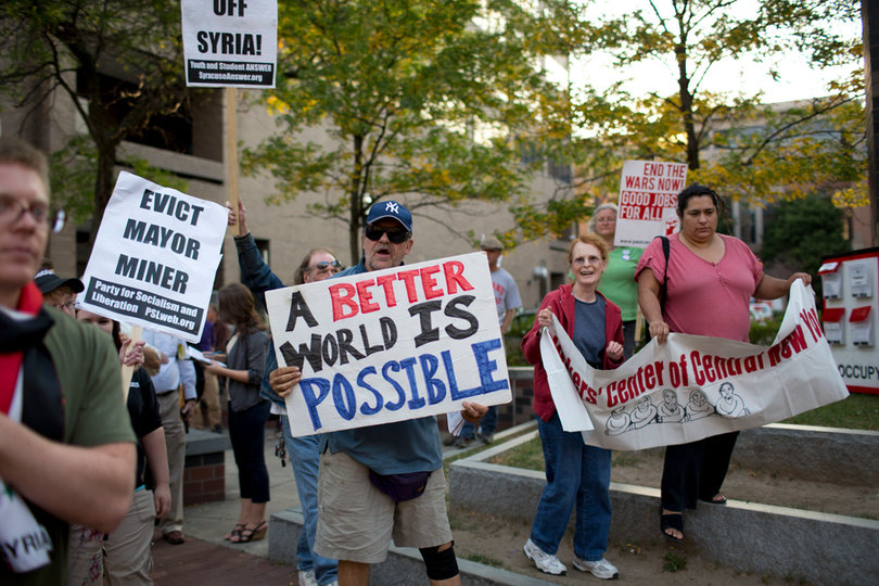 Supporters held up signs at the beginning of their walk.