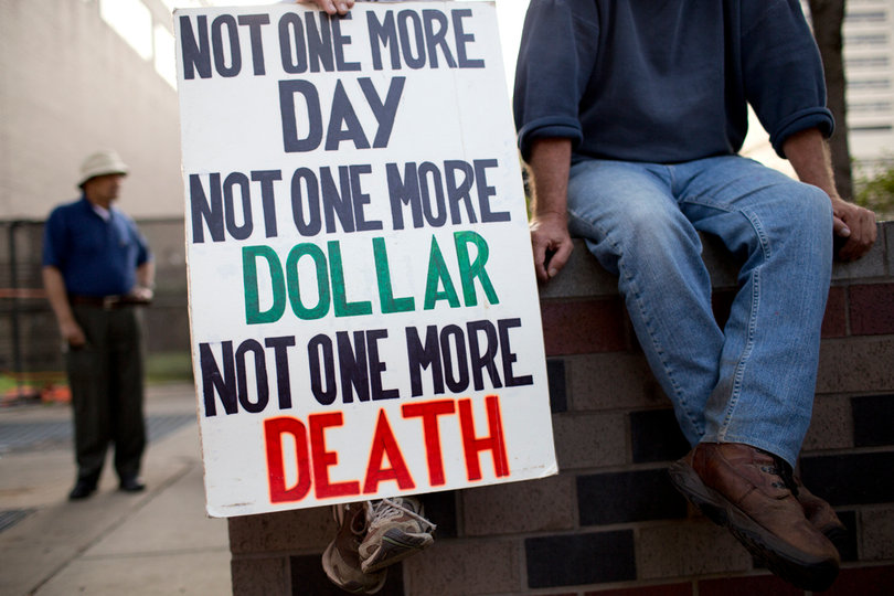 Supporters held up a sign against war.