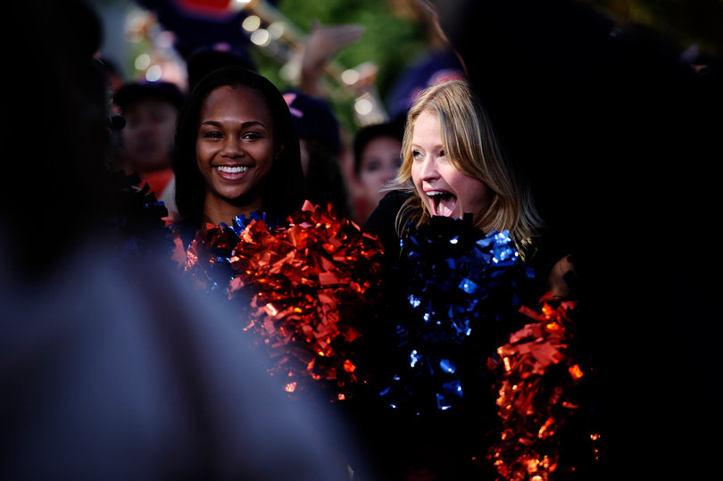 Sarah Haines cheers with the SU cheerleaders.