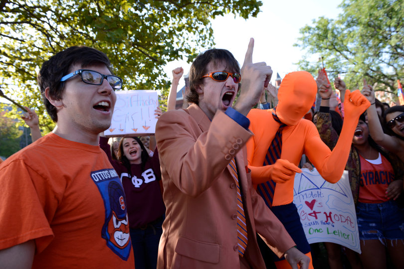 (From left) Brad Slavin, a junior information management major; Ben Maher, a junior sports management and psychology dual major; and Michael Collins, a junior history and economics dual major, cheer at the "Today" show event on campus.