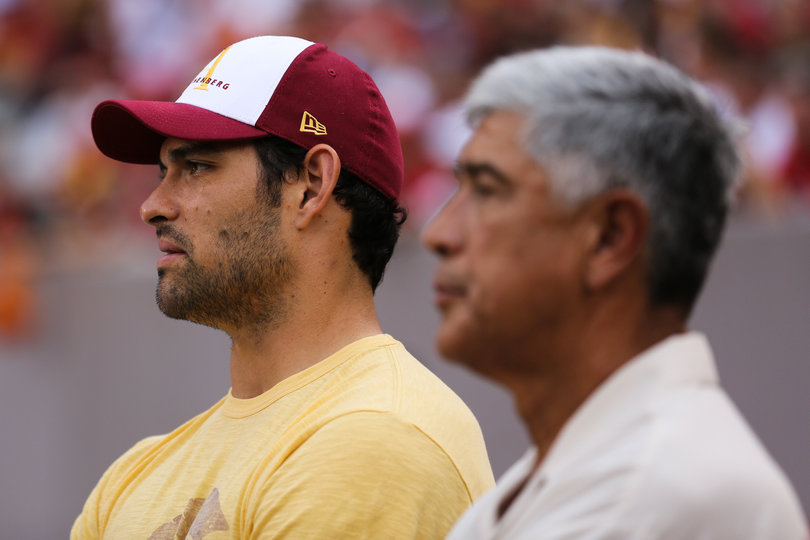Mark Sanchez and his father watch on the Trojan sideline.