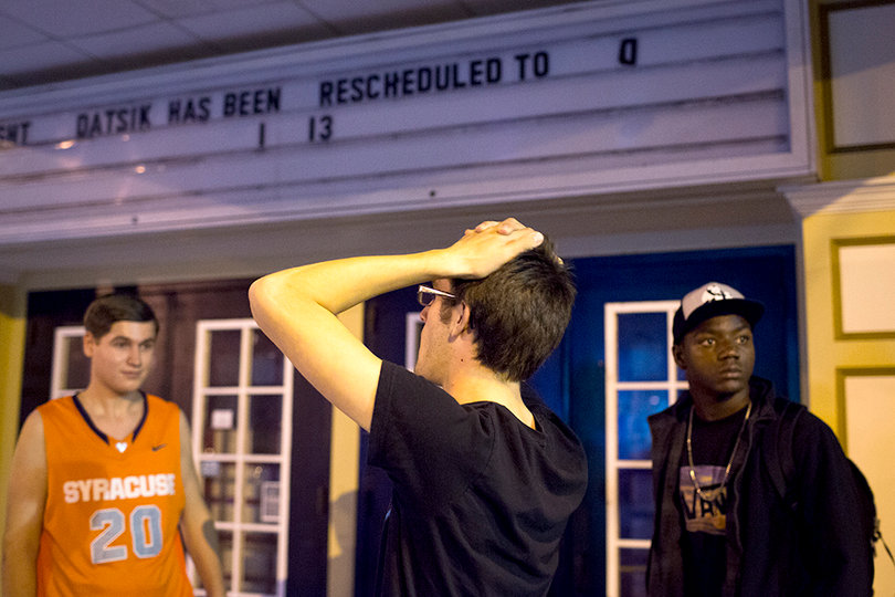 Adam Yates, a sophomore buisness adminstration major, and high schoolers Nick Echenique and Michael Yates stand outside the Westcott Theater on Wednesday night, frustrated over the rescheduling of the Datsik concert.