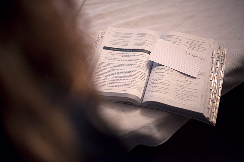 Stephanie Saltzgiver, a resident at Exodus 3 mission, points out her favorite bible passage.