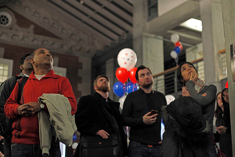 Viewers at the Maxwell 2012 Election Watch Party pause as CNN releases final polling announcements in New England states.