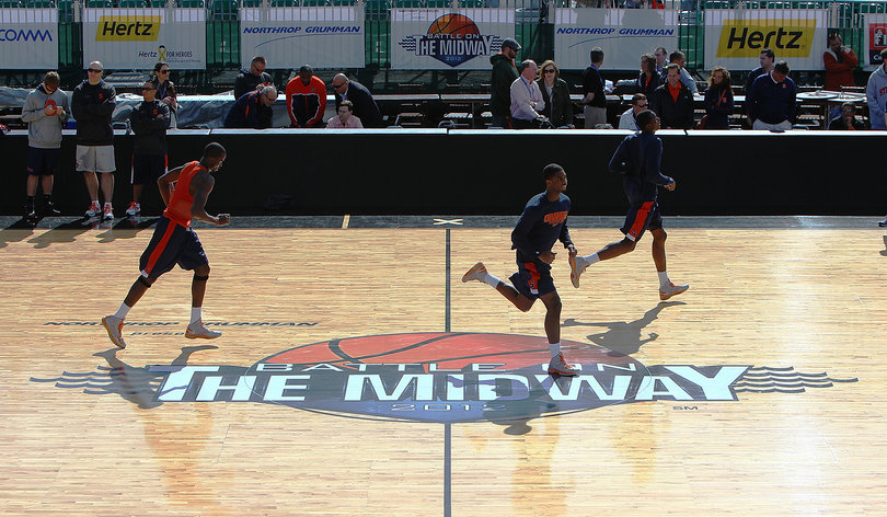 Syracuse players run on the court over the Battle on the Midway logo during media day on Nov. 10, 2012 before Sunday's Battle on the Midway game against the San Diego State Aztecs aboard the USS Midway.