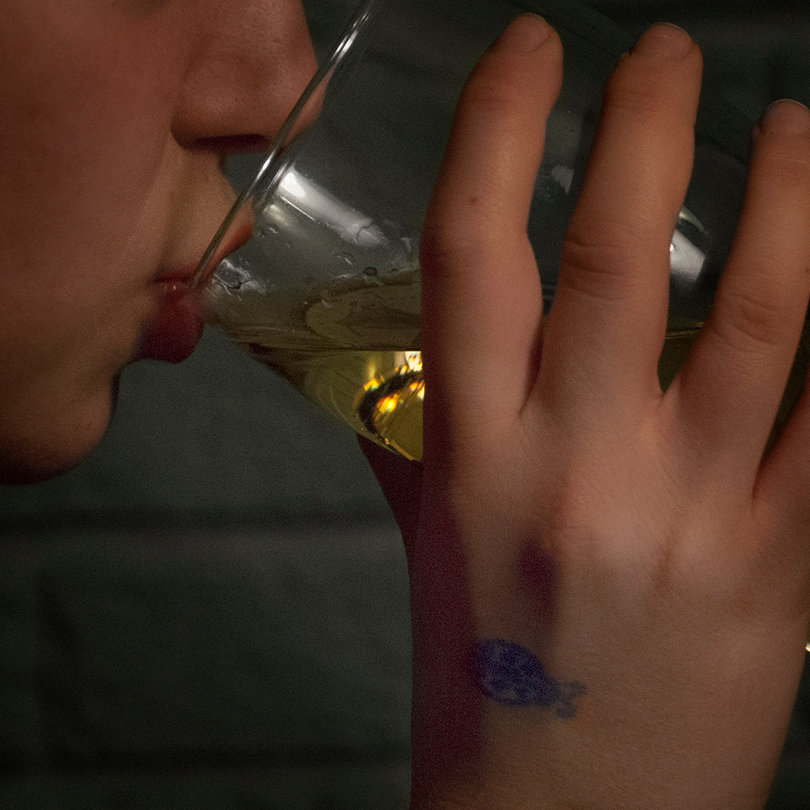Step 3: Underage drinker enters the bar by flashing the stamp to the awaiting bouncer. 