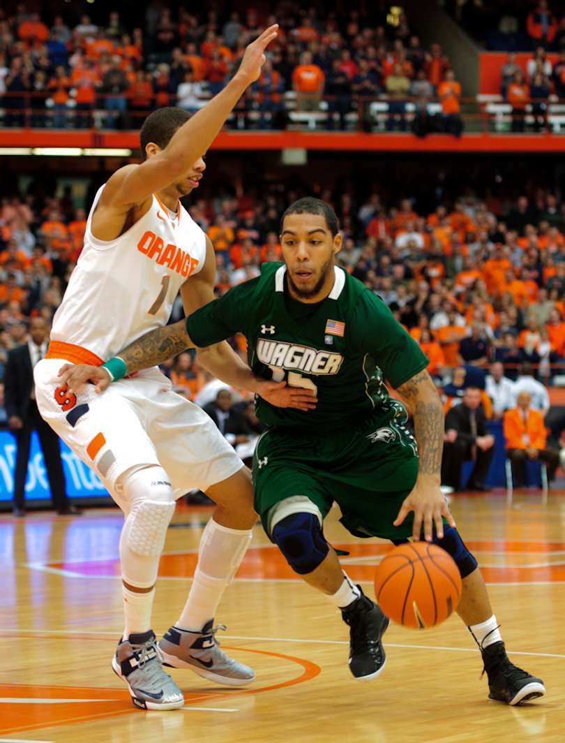 Wagner guard Kenneth Ortiz attempts to drive past Michael Carter-Williams.