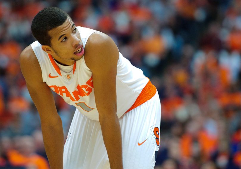 Syracuse guard Michael Carter-Williams catches his breath during a pause in the game.