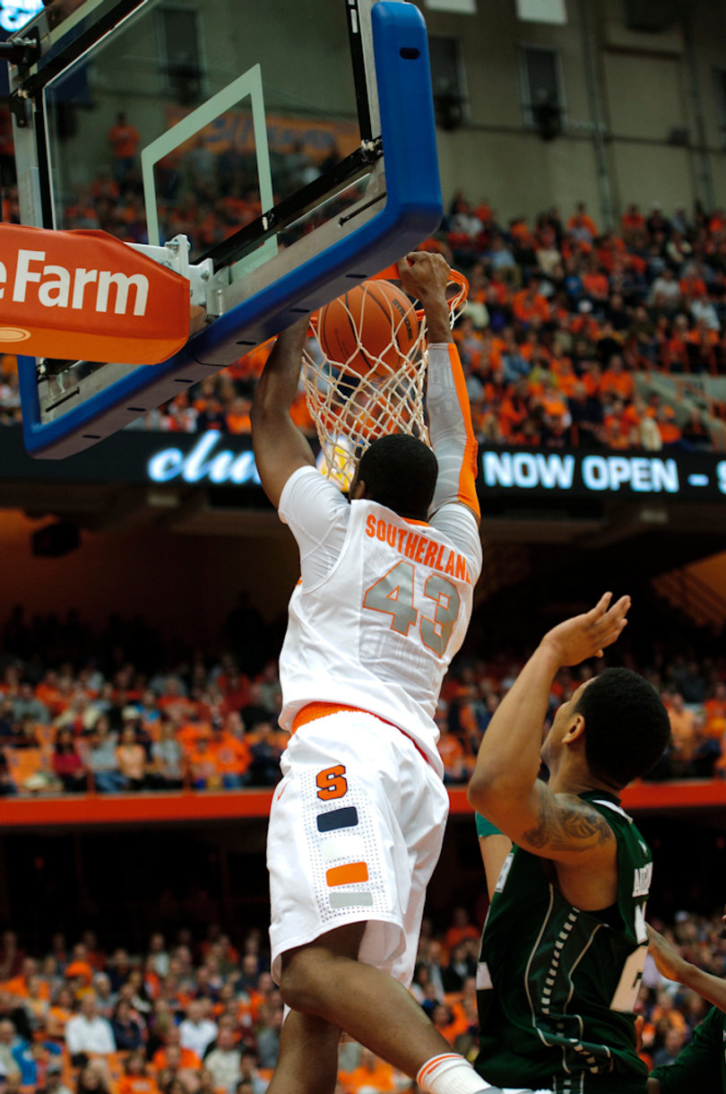 Syracuse forward James Southerland slams a dunk home from the baseline.