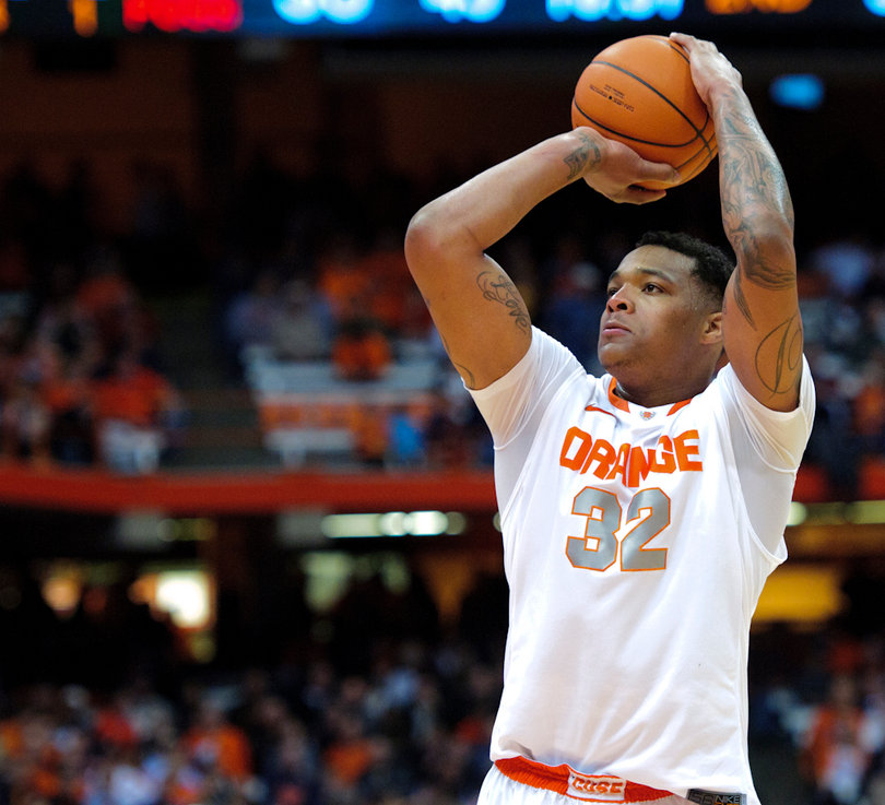Syracuse forward DaJuan Coleman attempts a free throw.