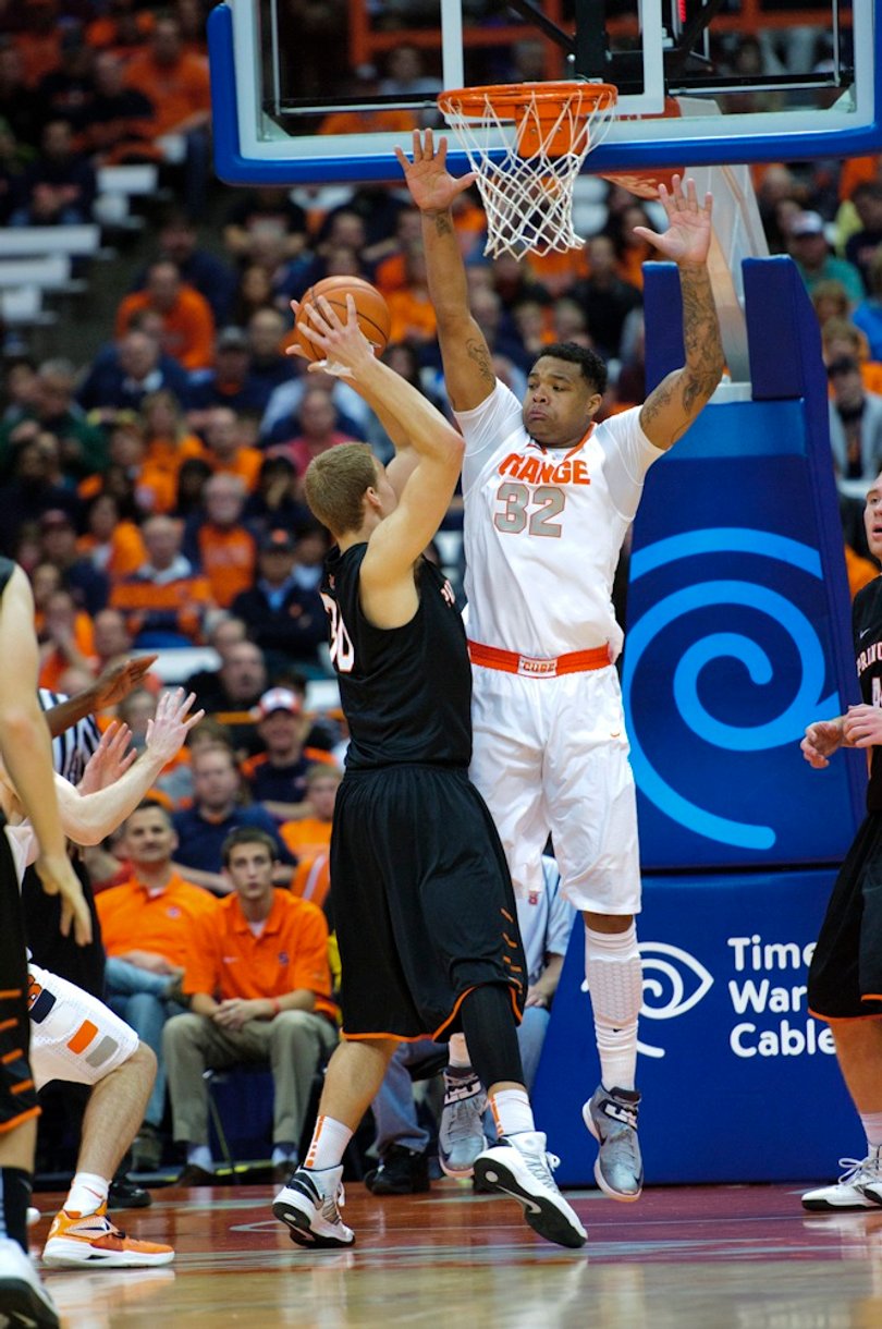 SU's DaJuan Coleman guards Princeton's Hans Brase on Wednesday night. The Orange's size caused problems for the Tigers offensively.