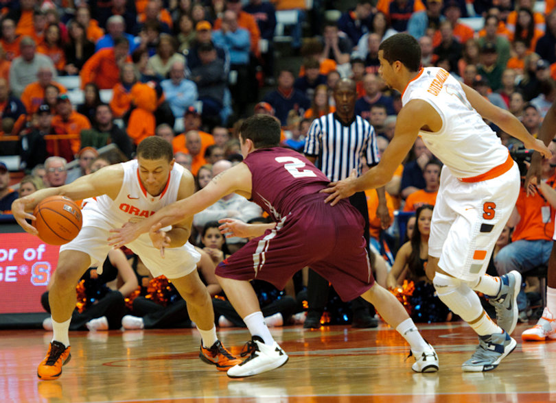 Brandon Triche dribbles against pressure from Colgate guard Mitch Rolls.