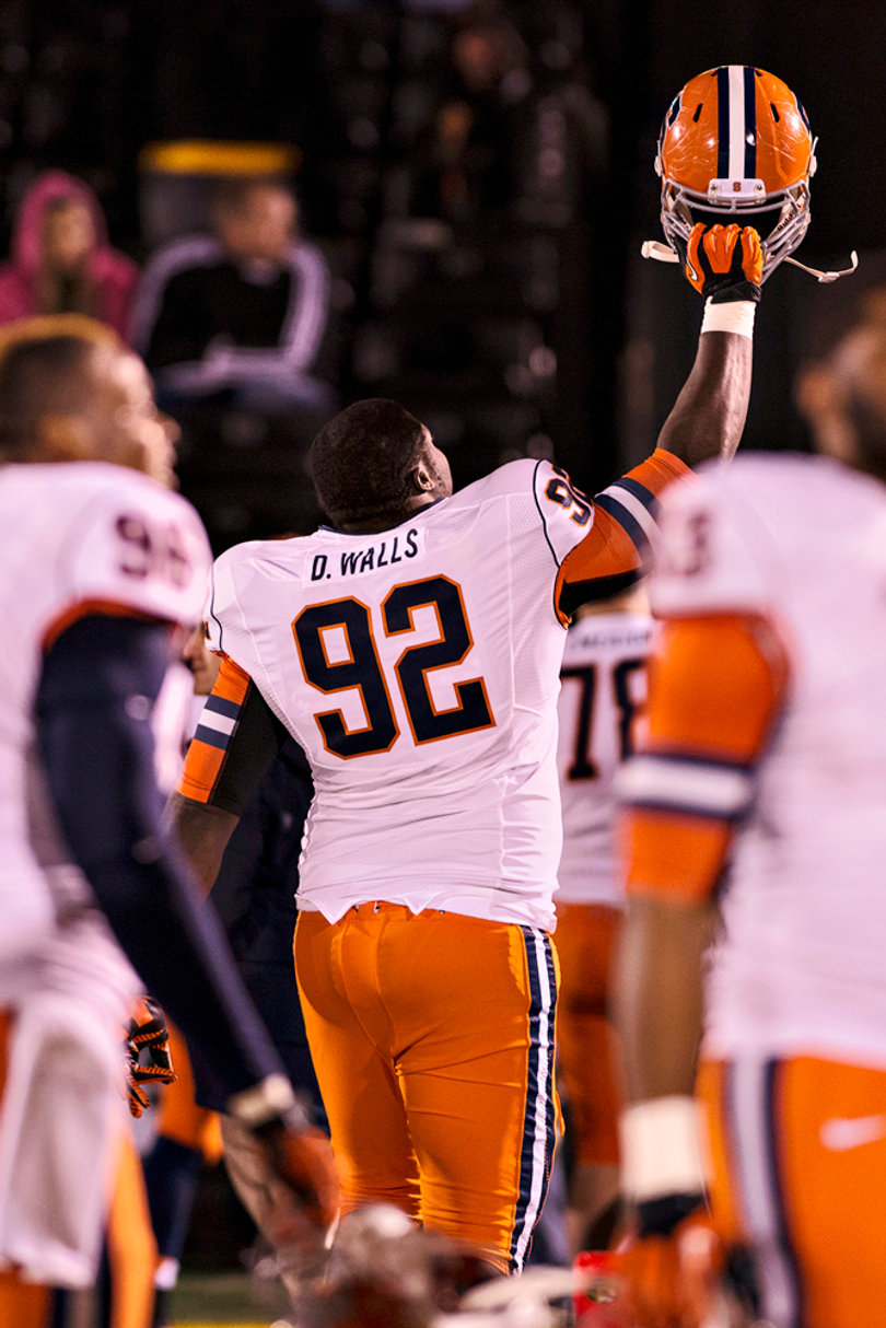 Davon Walls lifts his helmet up in celebration following Syracuse's 31-27 win over Missouri.