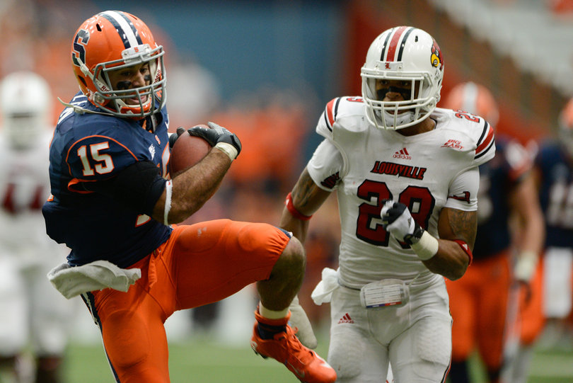 Alec Lemon makes a catch in front of a Louisville defender.