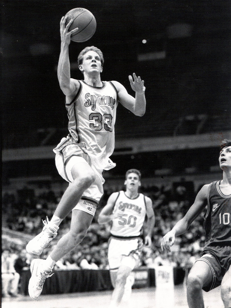 After his playing career as a shooting guard for Syracuse, Mike Hopkins joined Jim Boeheim's coaching staff and vaulted up the ranks to become his top assistant. Hopkins is preparing to take over as the Orange's head coach when Boeheim retires. 