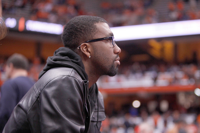 Former Syracuse basketball player Donte Greene watches from the crowd during SU's win over Eastern Michigan.