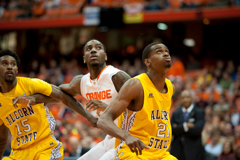 Rakeem Christmas jockeys for a position against two Alcorn State players.
