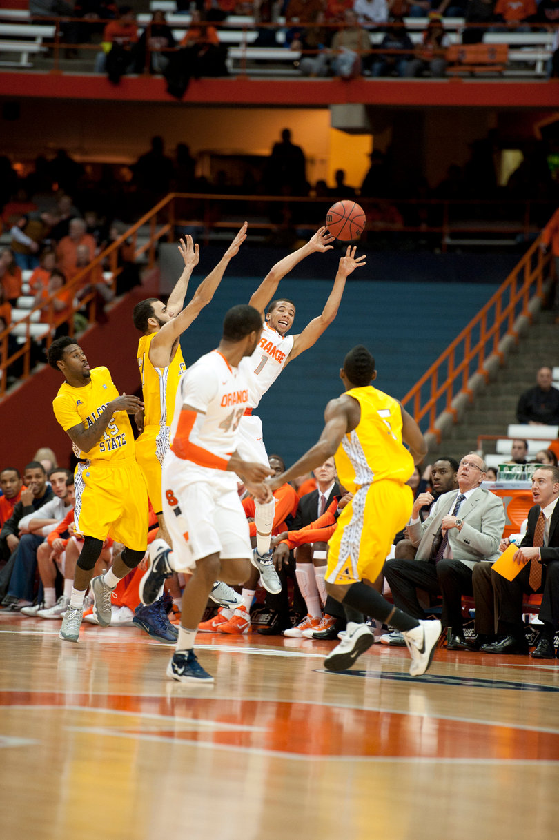 Michael Carter-Williams attempts to keep the ball in bounds.