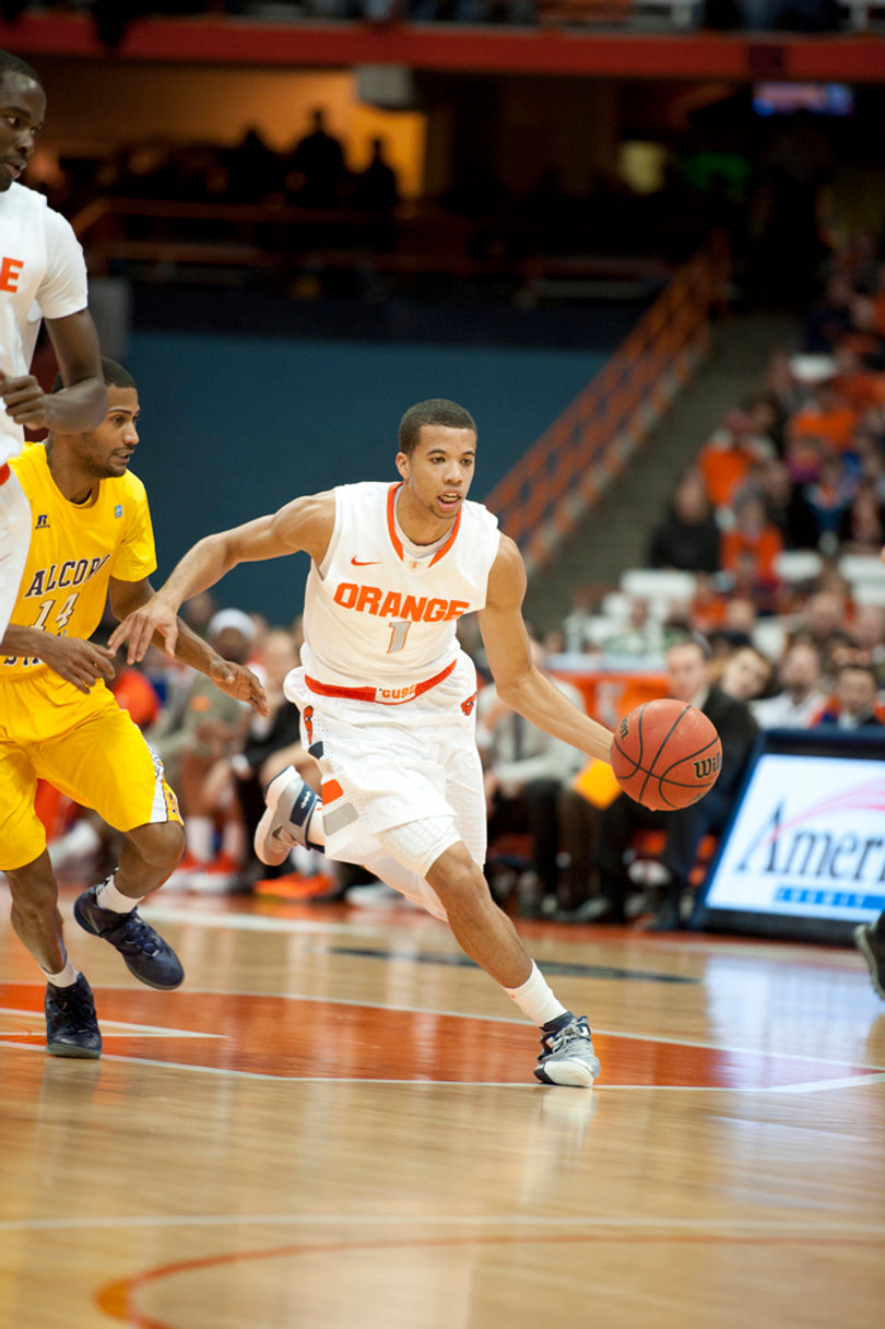 Michael Carter-Williams pushes the ball up the floor.