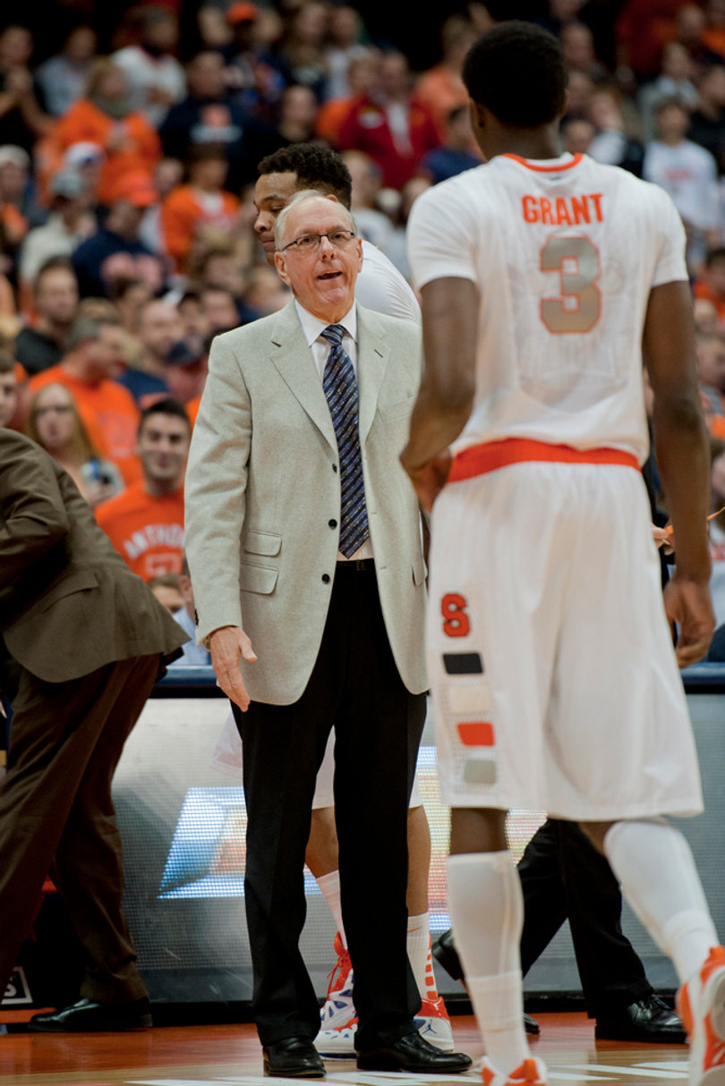 Jim Boeheim coaches Jerami Grant as he walks to the bench.