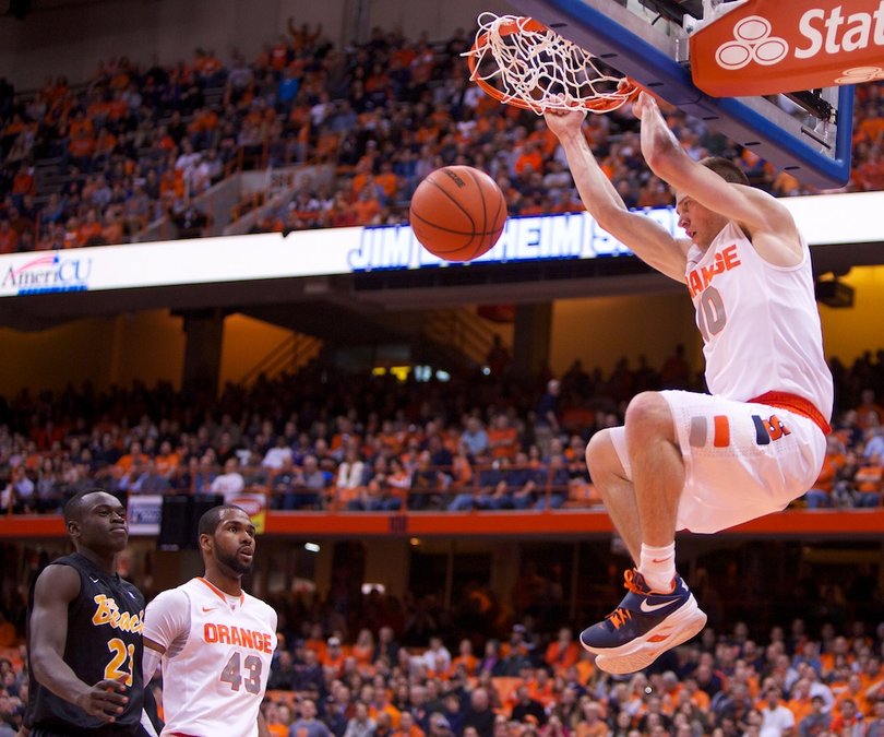 Syracuse University guard Trevor Cooney finishes an emphatic breakaway dunk during the Orange's rout of Long Beach State Thursday at the Carrier Dome. Cooney made 4-of-9 shots for 11 points in the Syracuse victory.