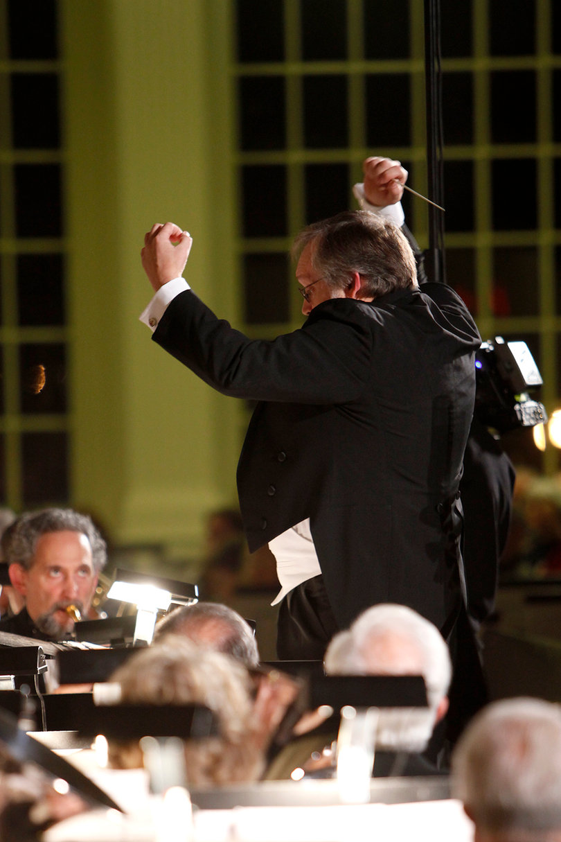 Jim Spencer, the director, conducts the ensemble during the concert. The ensemble performed a variety of songs, highlighting the French horn and trumpets. 
