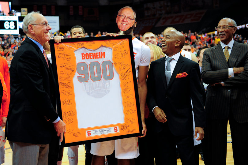Jim Boeheim and athletic director Daryl Gross laugh during a postgame celebration.