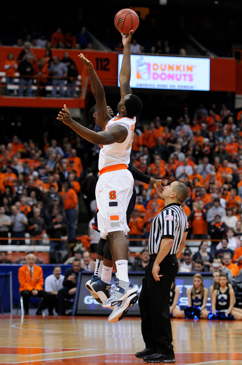 Syracuse forward Rakeem Christmas fights for the opening tip in the Orange's 72-68 win over Detroit on Monday in the Carrier Dome. Syracuse's win gave head coach Jim Boeheim his 900th career victory.