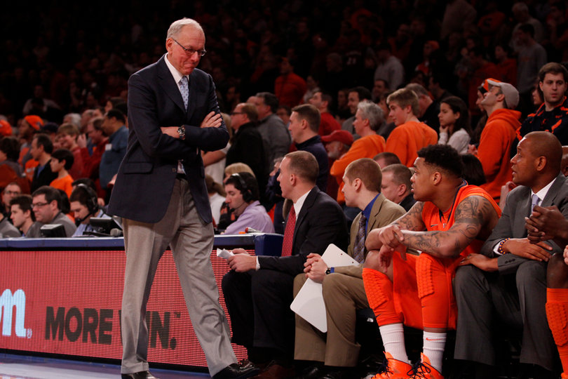 Jim Boeheim turns toward his bench while DaJuan Coleman watches on from the sideline. The freshman center played just four minutes in the loss.