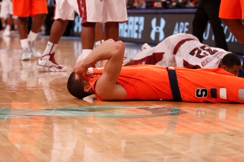 Michael Carter-Williams hides his face from the Madison Square Garden crowd of 12,648.