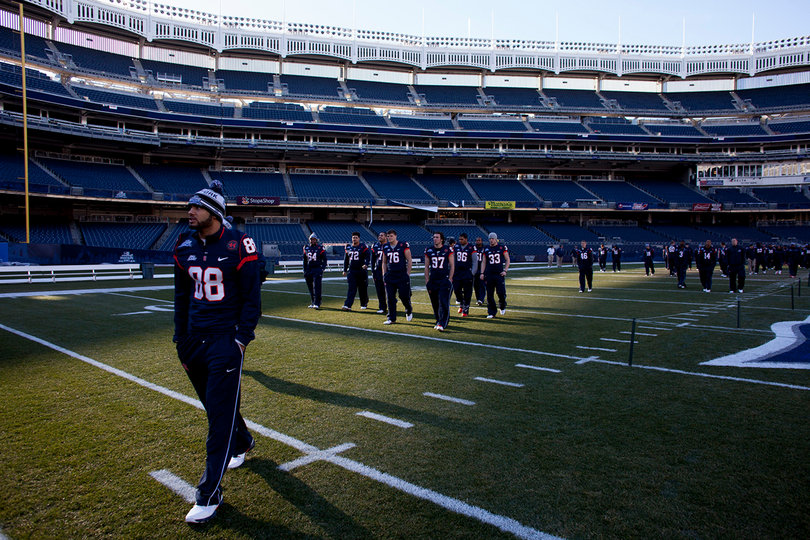 Wide receiver Jarrod West walks across the field at Yankee Stadium, a day before the Orange are scheduled to play West Virginia.