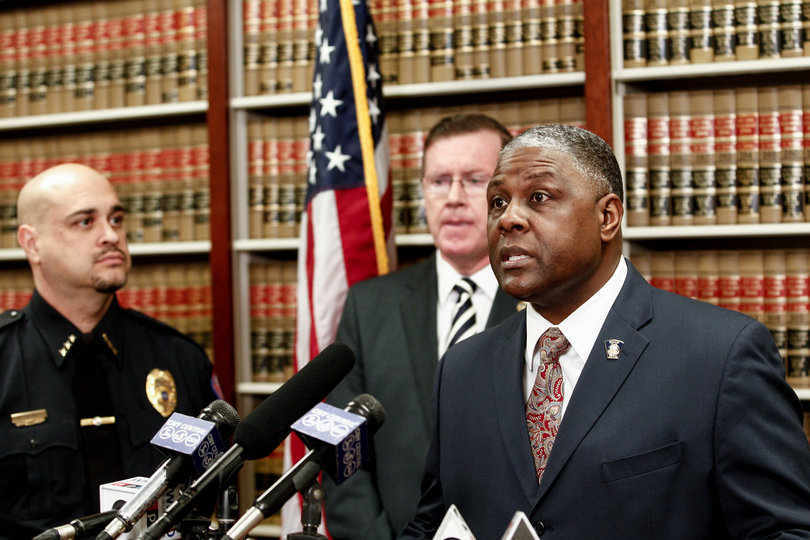 Syracuse Chief of Police, FRANK FOWLER (right) speaks to media at a press conference after the indictment of Roger Springfield, former sportscaster and media director of Syracuse University athletics, on four counts of second-degree unlawful surveillance for alleged secret locker room videos that stemmed from 2010 to 2012.