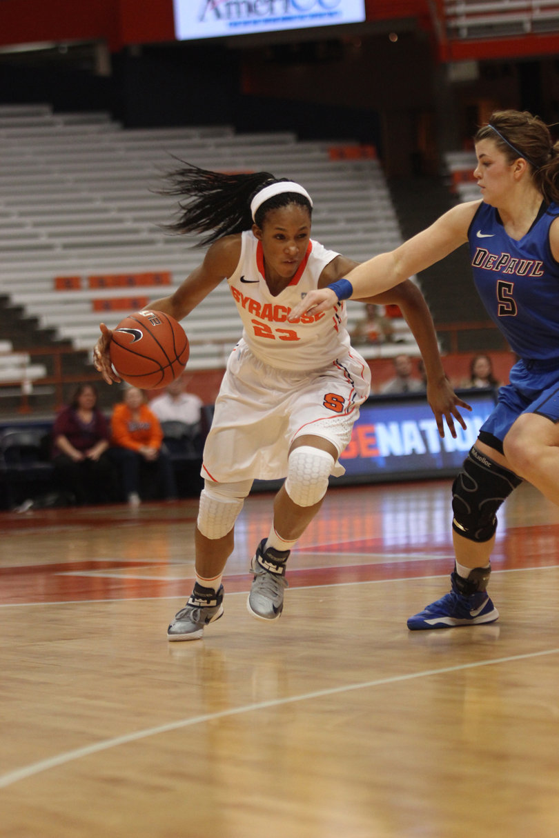 Pachis Roberts dribbles past DePaul guard Anna Martin.