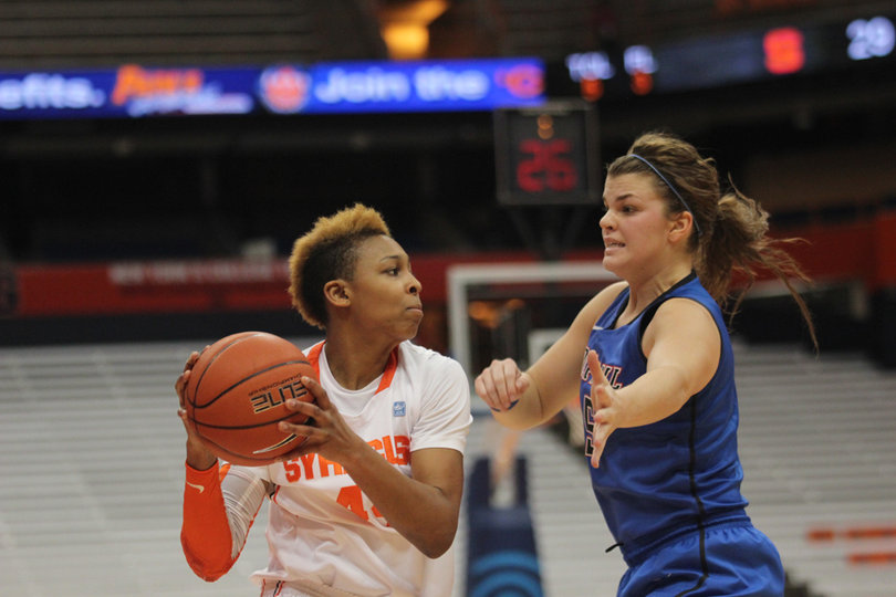 Carmen Tyson-Thomas looks to pass past Anna Martin.