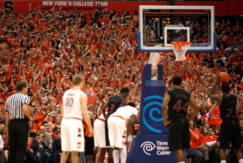 The Syracuse student section attempts to distract Cincinnati shooting guard Sean Kilpatrick during a free throw.  