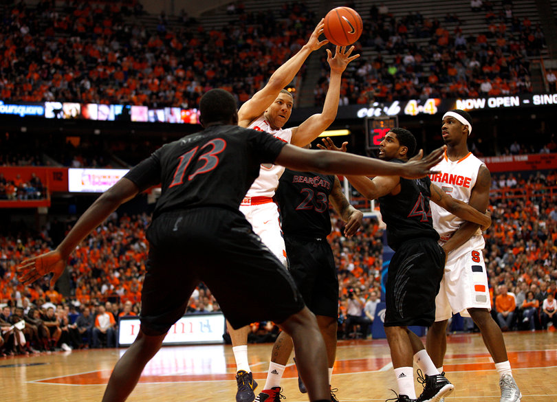 Syracuse guard Brandon Triche looks to pass the ball in the second half.