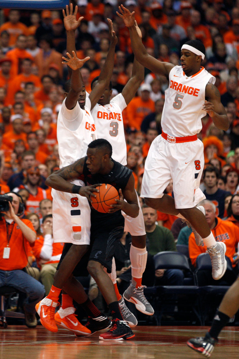 Cincinnati forward Justin Jackson is surrounded by Syracuse center, Baye Moussa Keita and forwards Jerami Grant and C.J. Fair.