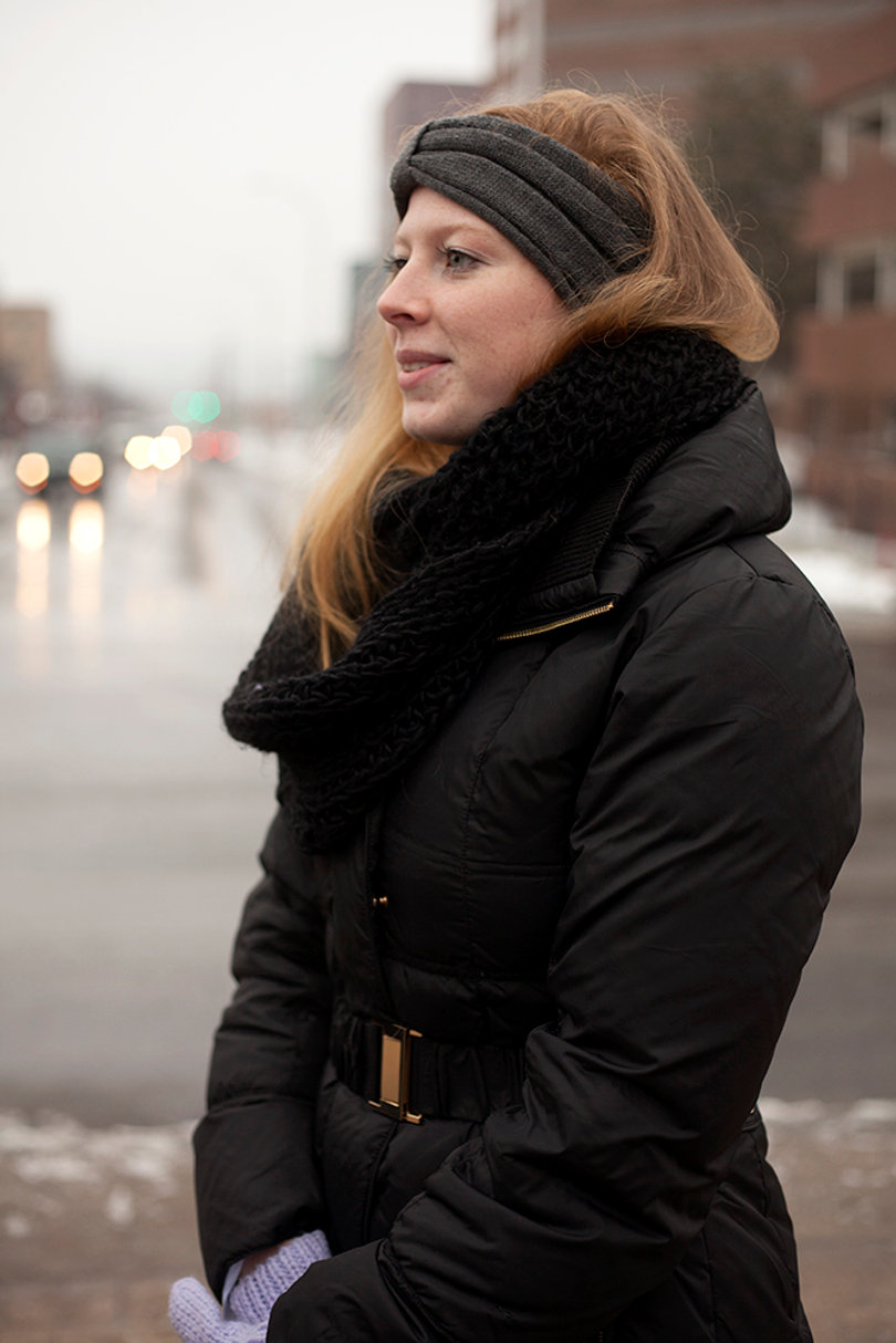 Jes Shanley, daughter of Joe Shanley, looks on as SU students protest her father’s position change.