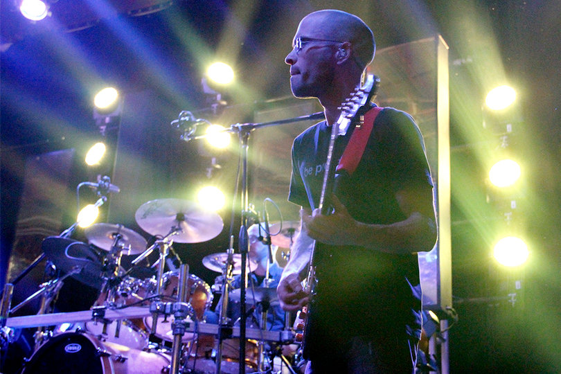 Mike Rumple, guitarist for the band Lotus, moves in time with the rest of the band when performing at The Westcott Theater on Wednesday, Jan. 30. 