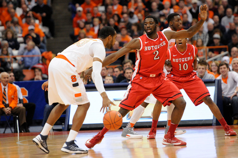 James Southerland looks to dribble past Rutgers forward Dane Miller.