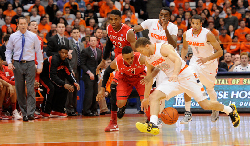 Brandon Triche fights for a losse ball with Rutgers guard Myles Mack.